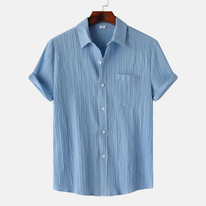 Blue striped shirt on a hanger against a white background
