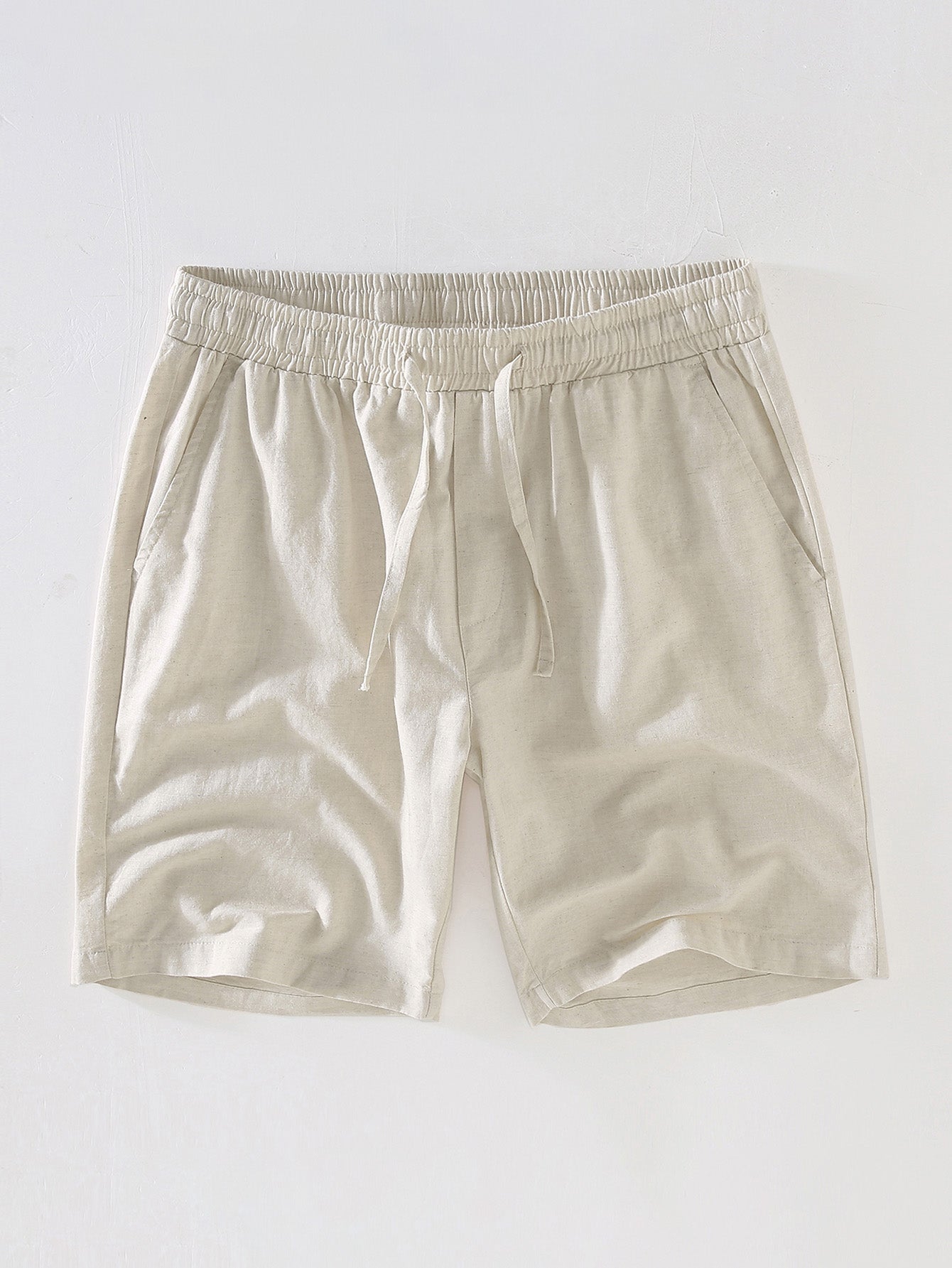 Beige shorts on a light gray background