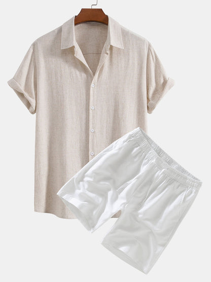 Beige shirt and white shorts on a hanger against a white background