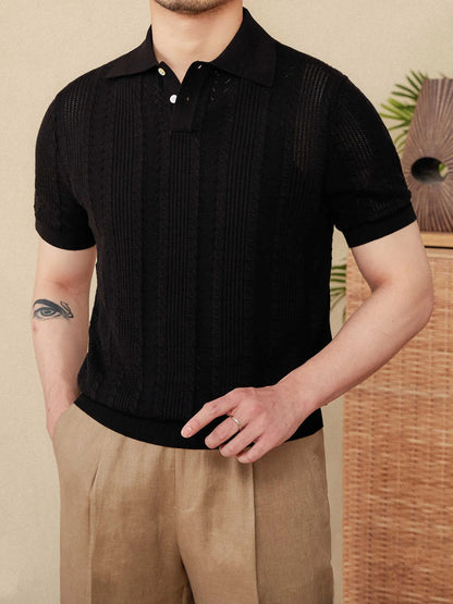 Men's black Pointelle knit polo featuring a sophisticated geometric open-stitch pattern and a tonal, professional buttoned neckline.