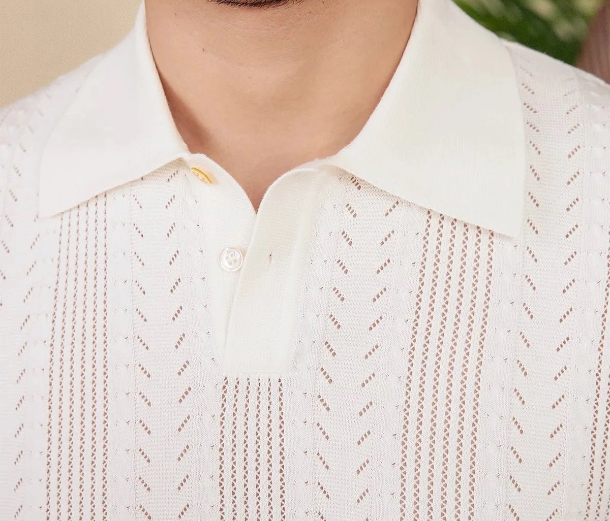 Men's white Pointelle knit polo featuring a sophisticated geometric open-stitch pattern and a classic buttoned neckline.