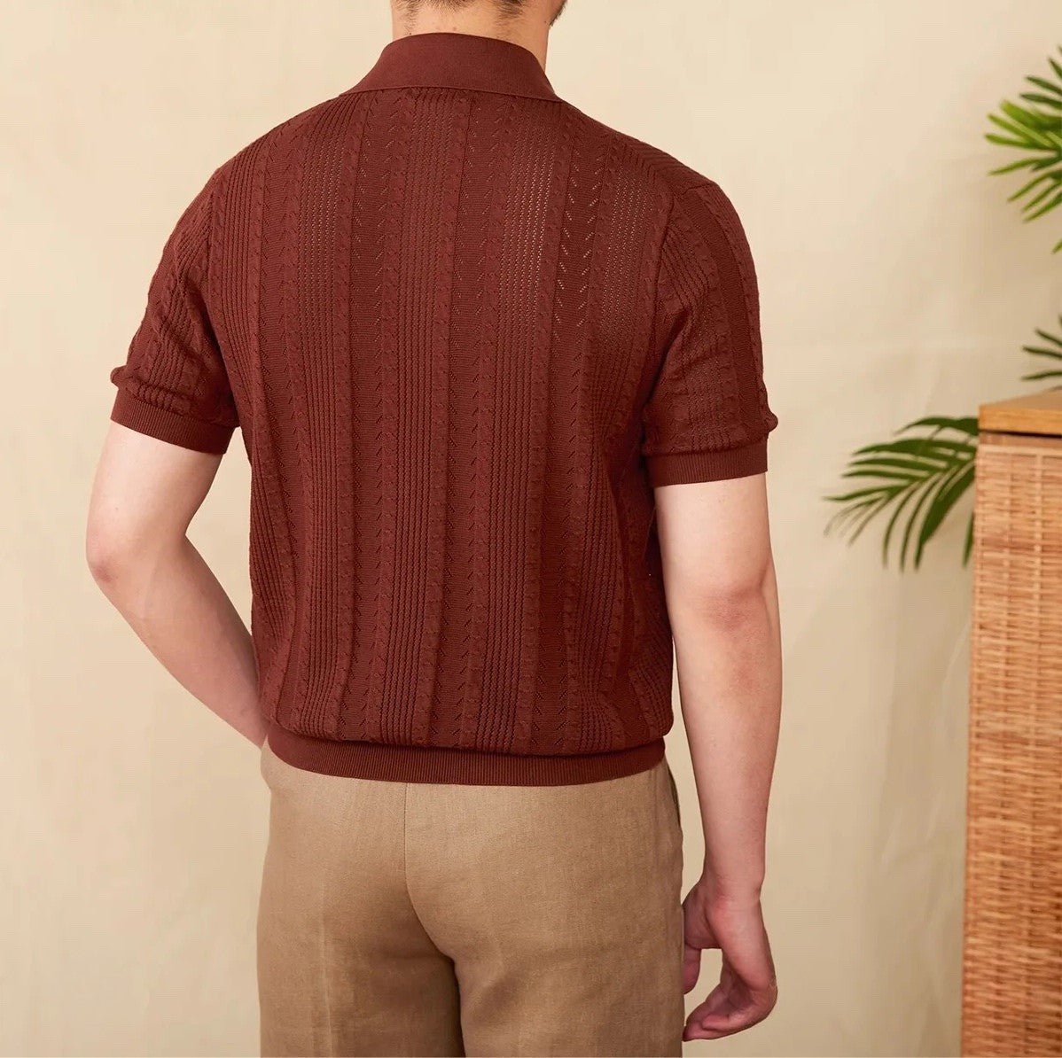 Premium Men's rust brown textured polo showcasing an intricate pointelle knit and a tailored, breathable fit.