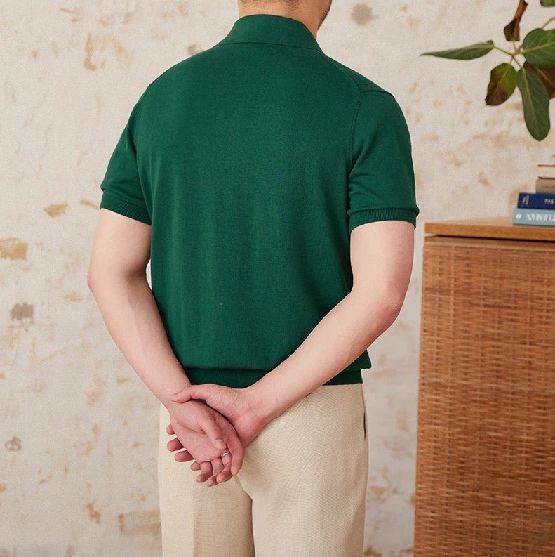 Men's forest green 100% cotton polo featuring an intricate pointelle vertical ribbed texture and a refined buttoned placket.