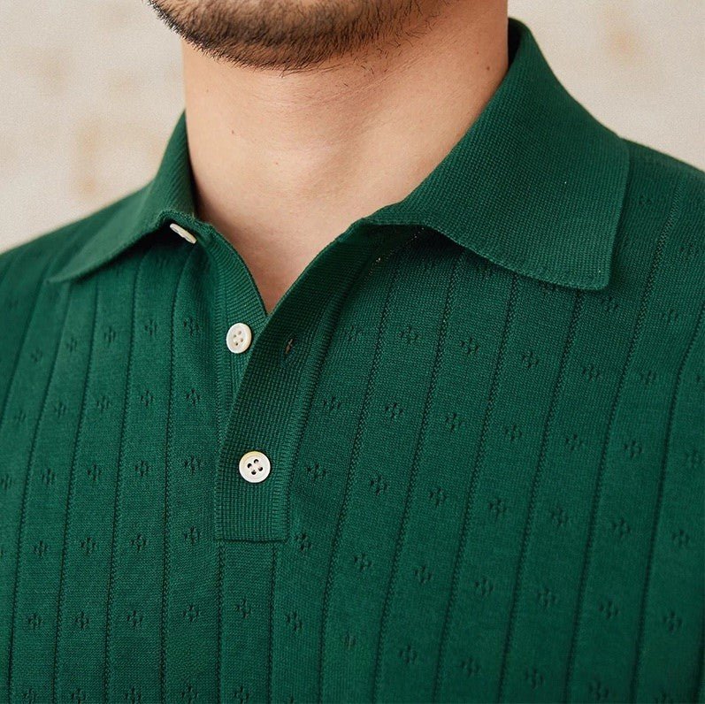 Men's forest green 100% cotton polo featuring an intricate pointelle vertical ribbed texture and a refined buttoned placket.