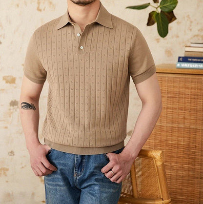 Men's warm camel-toned 100% cotton polo with a classic buttoned neckline and an architectural vertical ribbed pattern.