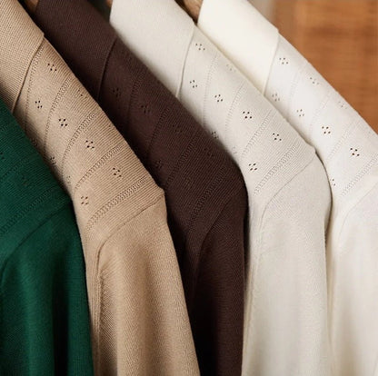 Men's warm camel-toned 100% cotton polo with a classic buttoned neckline and an architectural vertical ribbed pattern.
