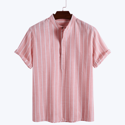Pink and white striped shirt on a hanger against a white background