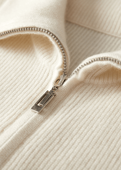 Close-up of the LORMIER cashmere vest zipper and ribbed mock-neck, highlighting the luxury texture and craftsmanship.