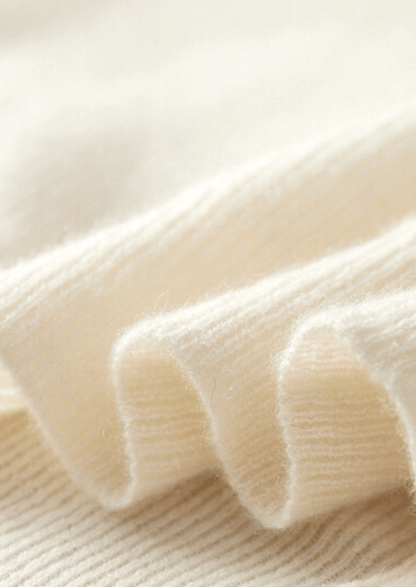 Close-up of the LORMIER cashmere vest zipper and ribbed mock-neck, highlighting the luxury texture and craftsmanship.