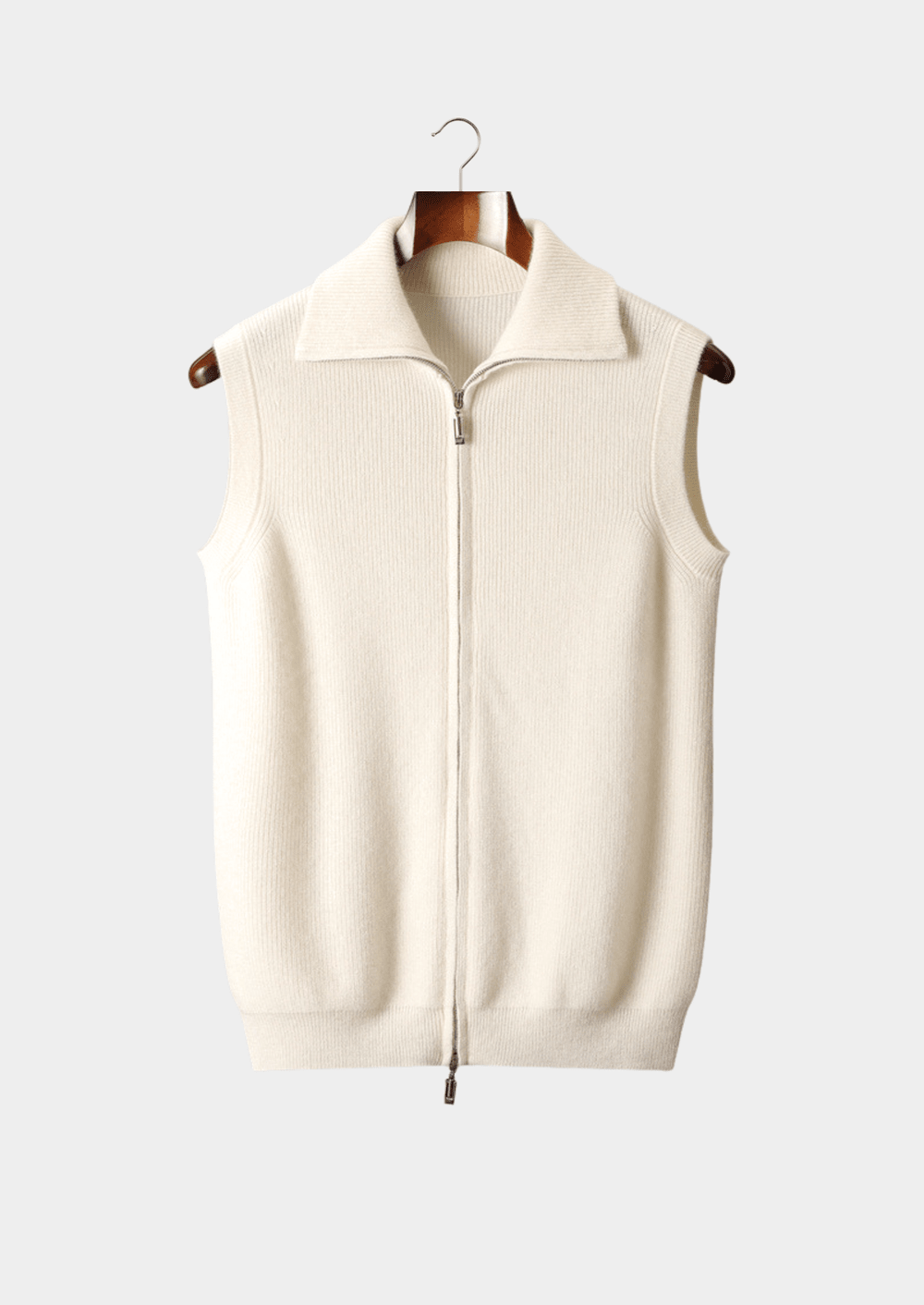 Men’s ivory cashmere zip-up vest featuring a clean, minimalist silhouette and a structured mock-neck collar for a sophisticated layered look.