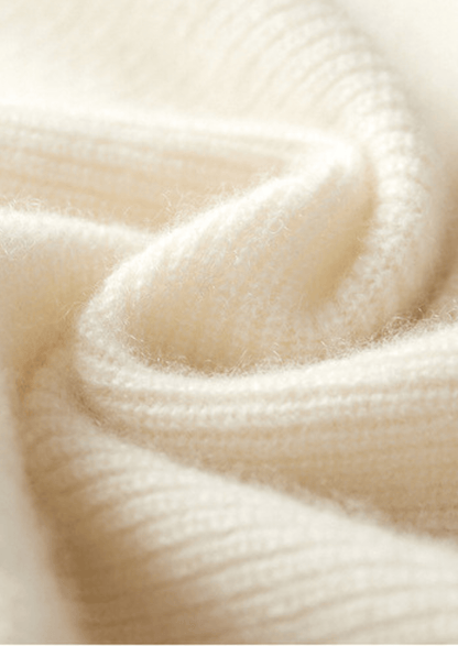 Close-up of the LORMIER cashmere vest zipper and ribbed mock-neck, highlighting the luxury texture and craftsmanship.