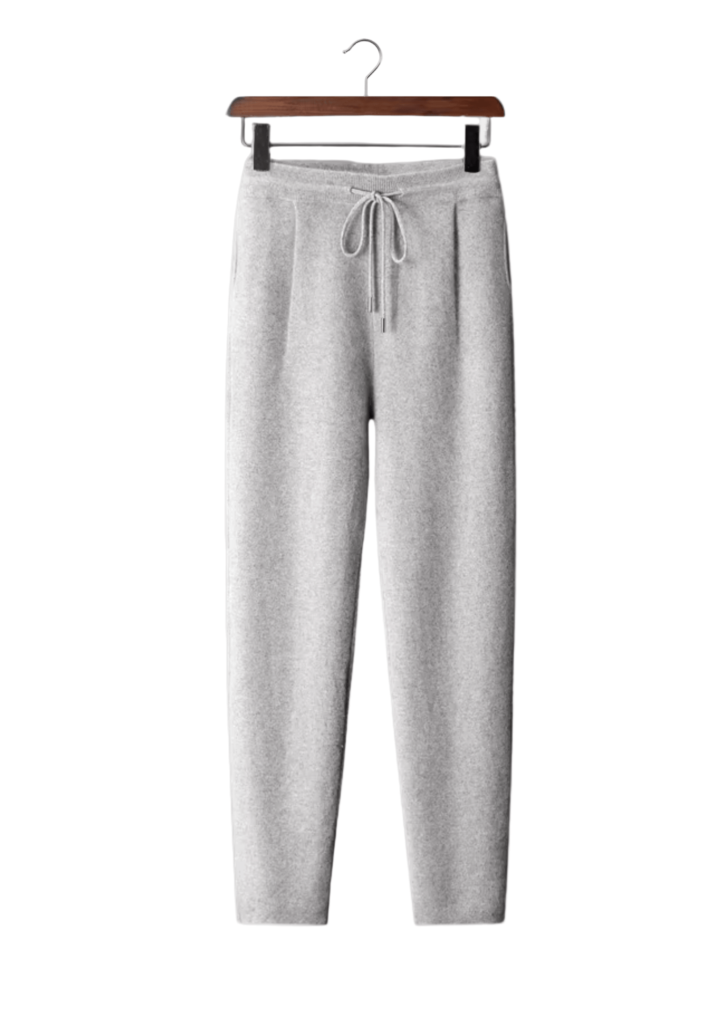 Gray sweatpants on a hanger against a white background