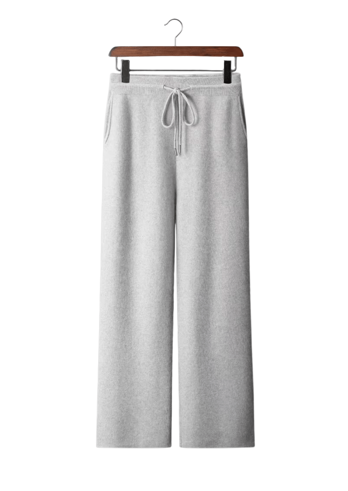 Gray sweatpants on a hanger against a white background