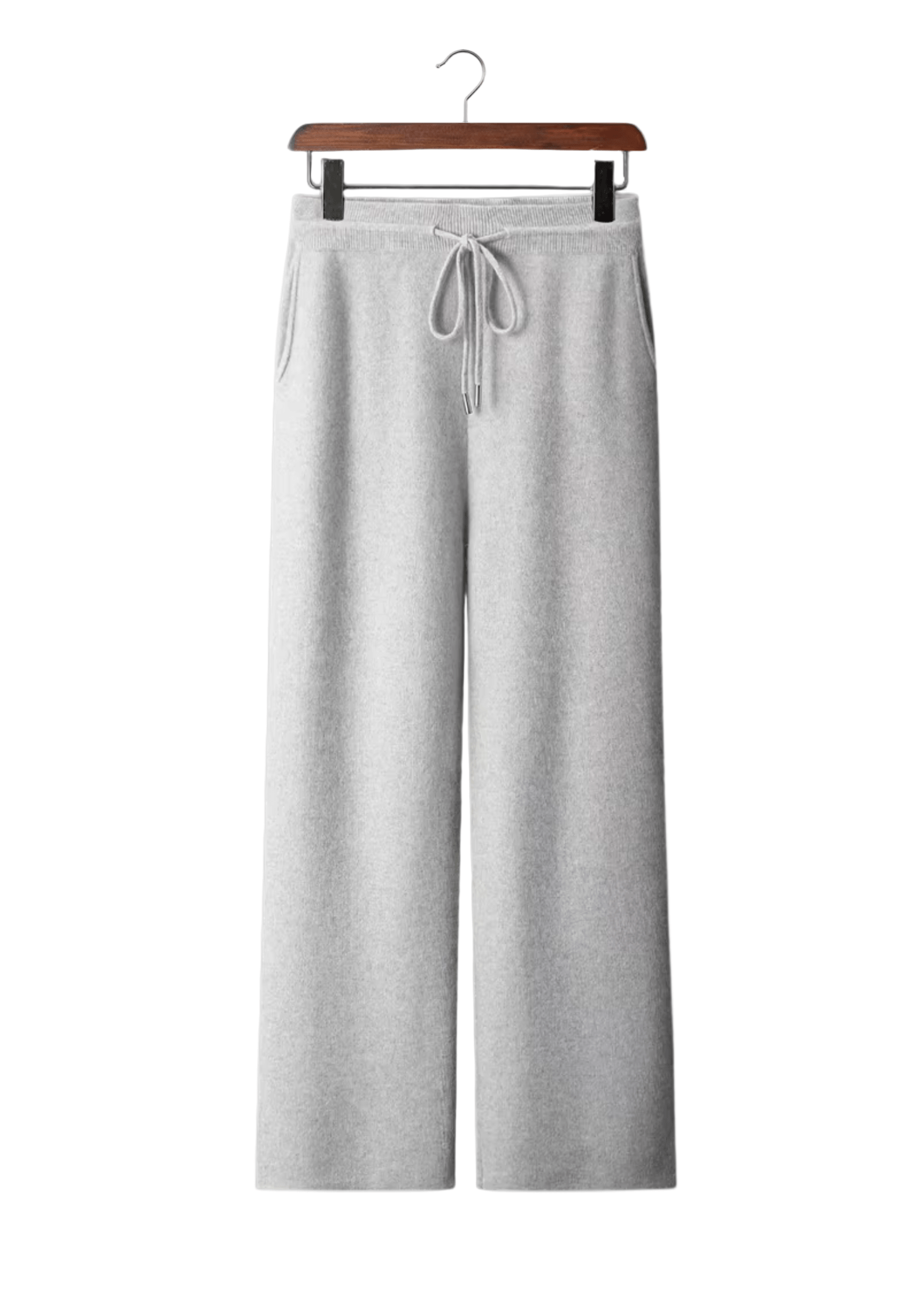 Gray sweatpants on a hanger against a white background