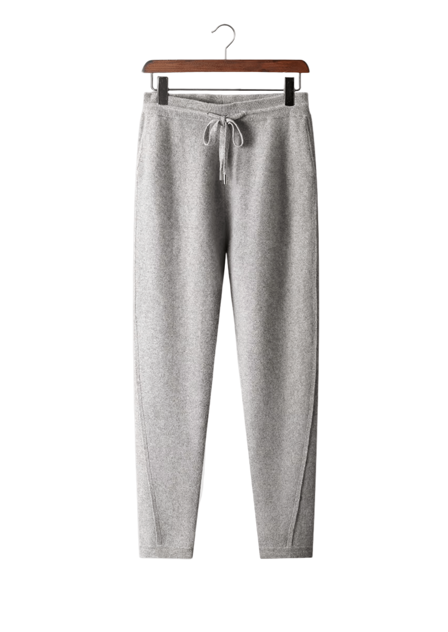Gray sweatpants on a hanger against a white background