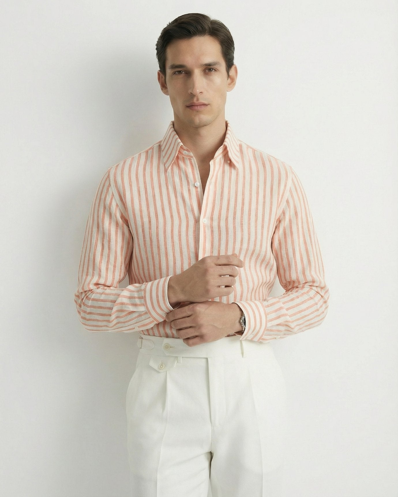 Men's orange and white vertical striped premium linen shirt featuring a short-sleeved button-down design.