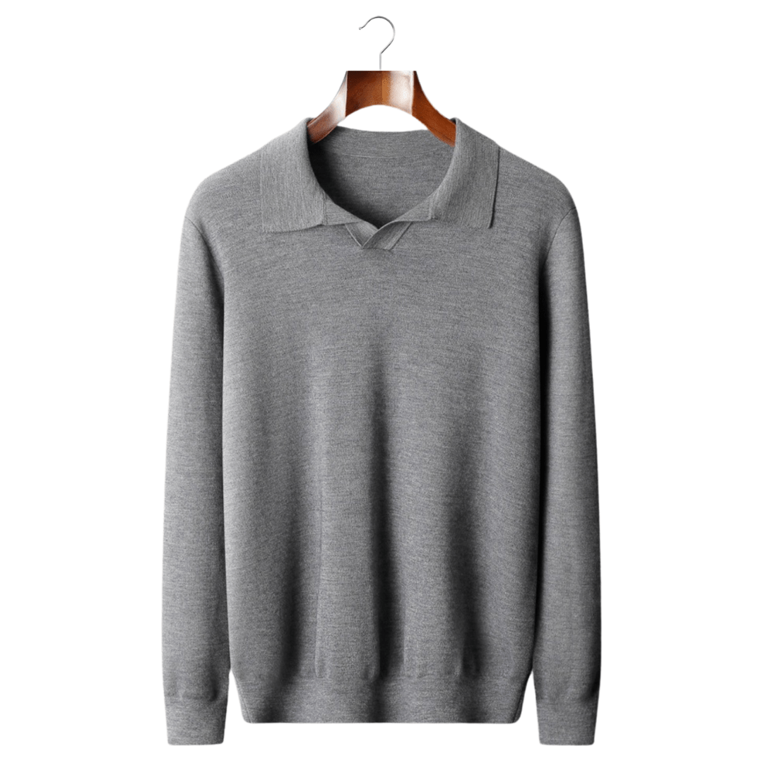 Gray sweater on a wooden hanger against a white background