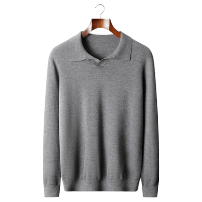 Gray sweater on a wooden hanger against a white background