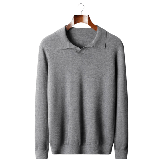 Gray sweater on a wooden hanger against a white background