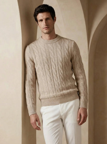 Man wearing a beige 100% cashmere sweater with a refined ribbed crewneck and cuffs.
