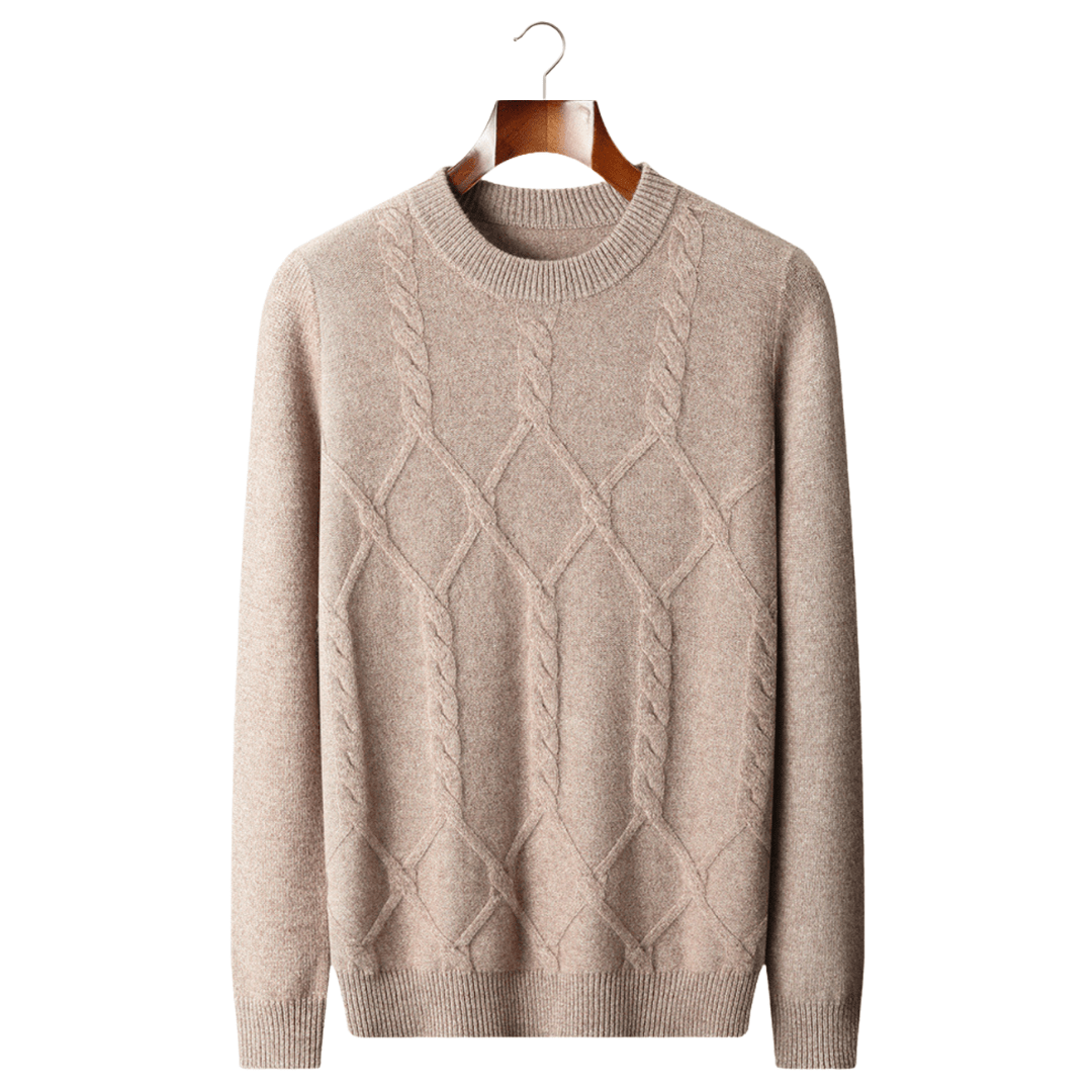 Beige sweater with cable knit pattern on a hanger against a white background