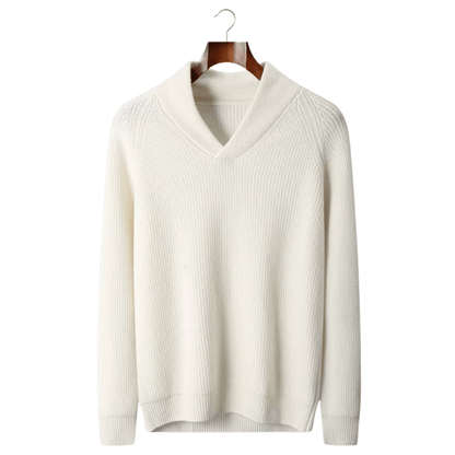 White sweater on a wooden hanger against a white background