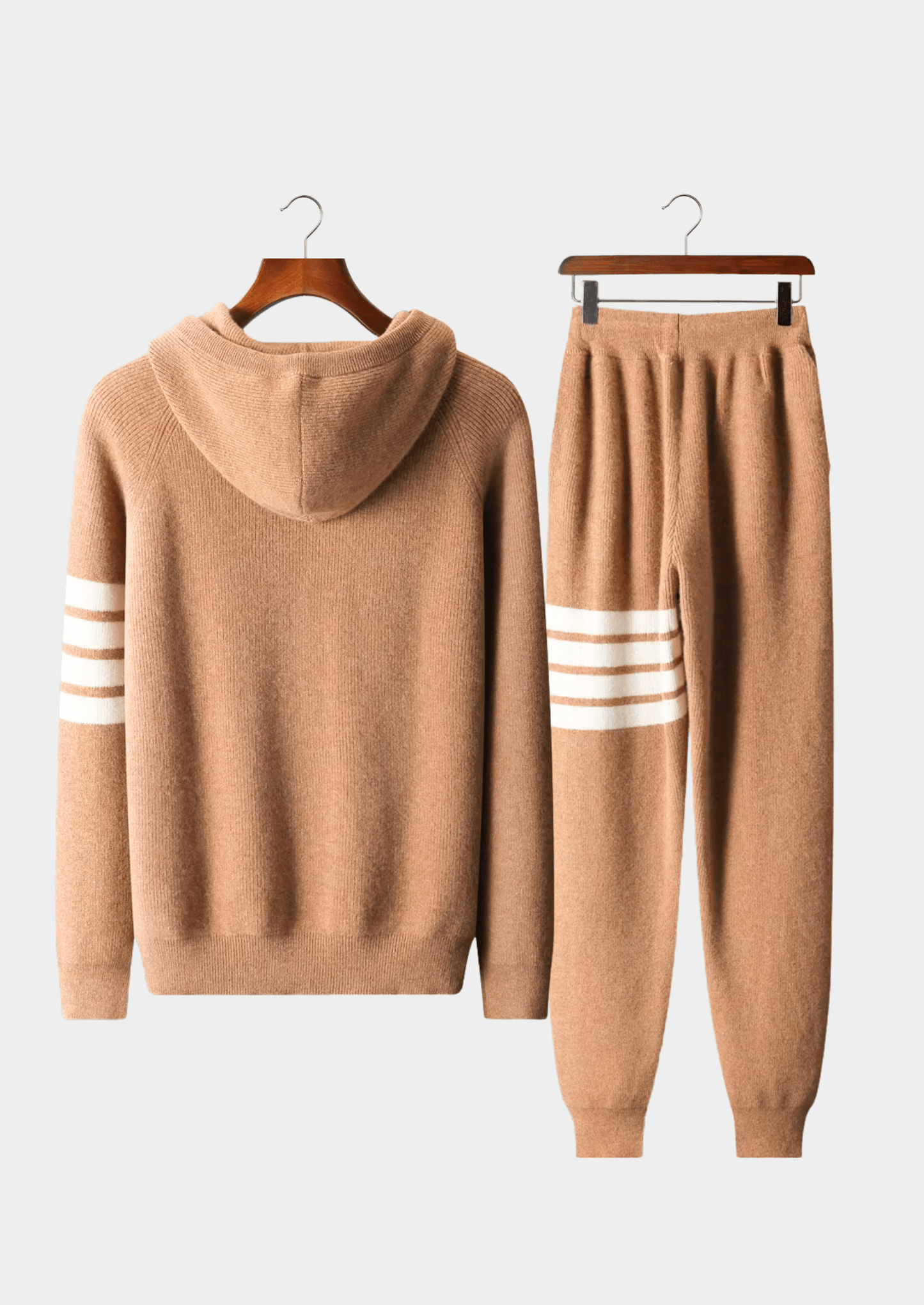 Rich camel color Merino wool striped tracksuit sweater set, highlighting the luxury knit texture and athletic-inspired four-stripe design.
