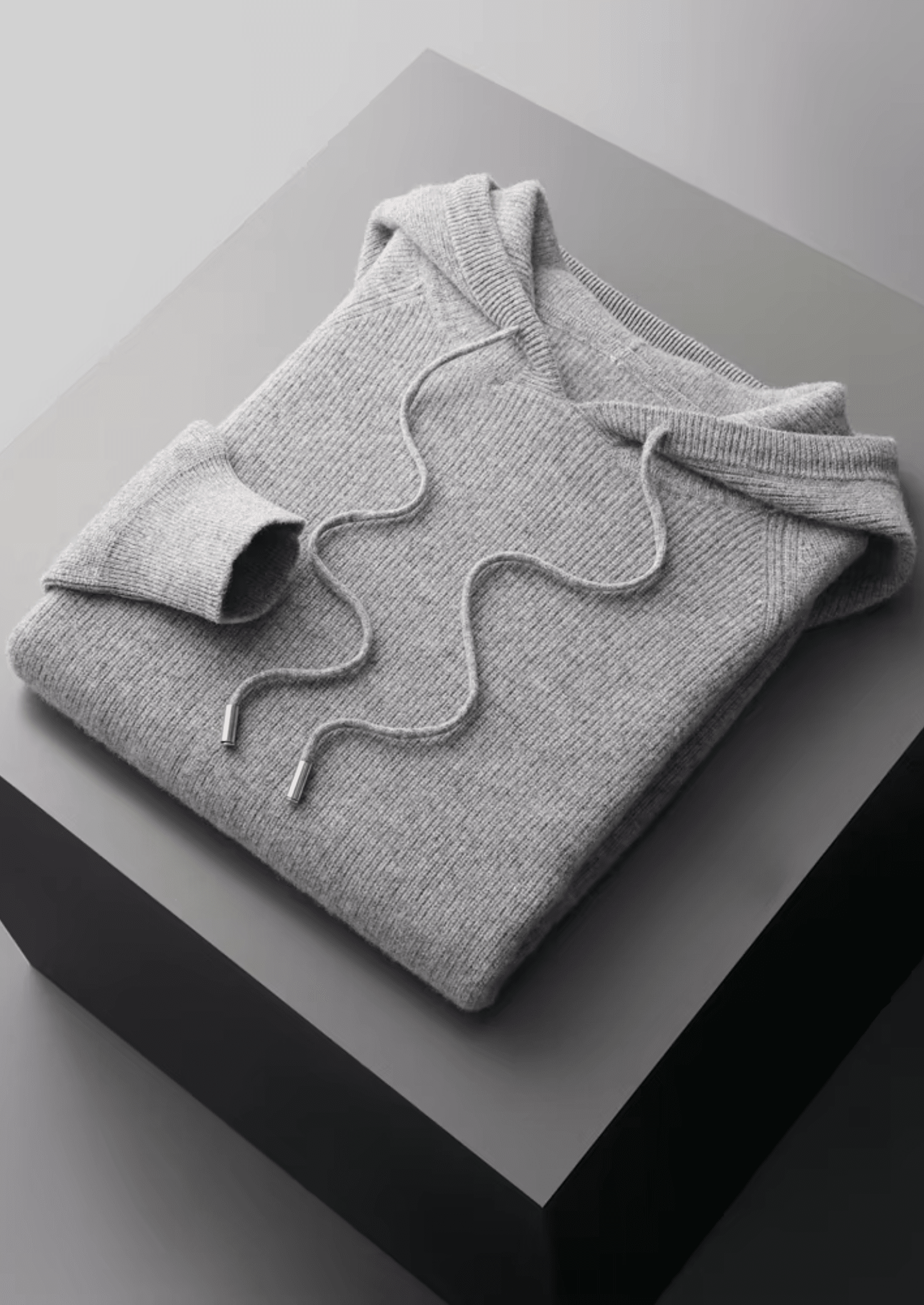 Men’s heather gray Merino wool tracksuit featuring a pullover hoodie and joggers with signature white stripes on the sleeve and thigh.