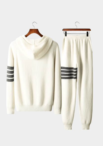 Elegant ivory white Merino wool tracksuit featuring a soft-touch knit hoodie and matching tailored joggers with tonal stripes.
