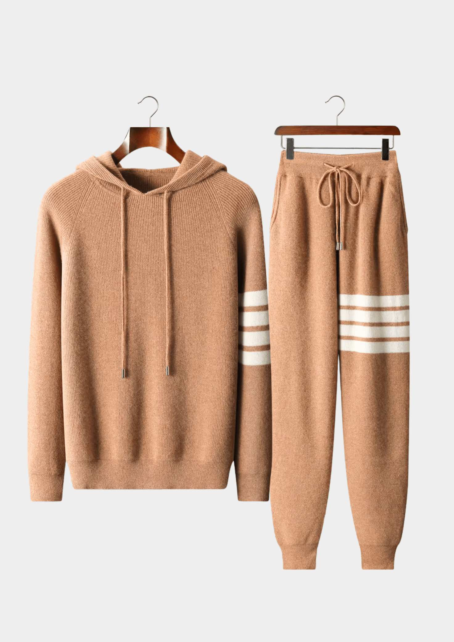 Rich camel color Merino wool striped tracksuit sweater set, highlighting the luxury knit texture and athletic-inspired four-stripe design.