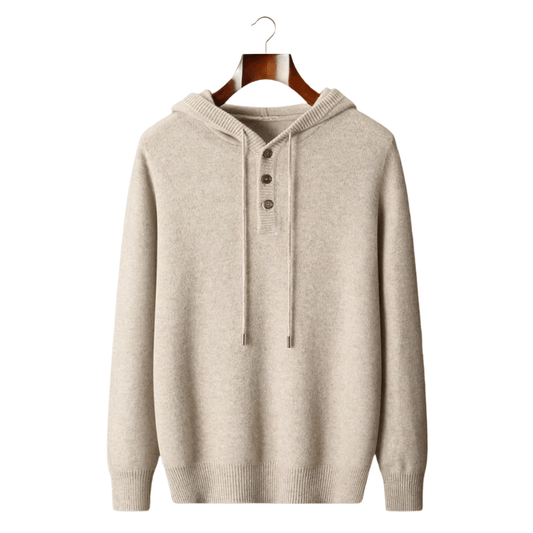 Beige hoodie on a wooden hanger against a white background