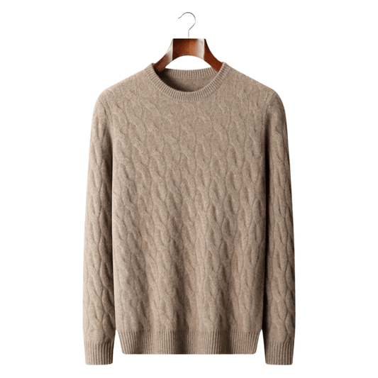 Beige cable knit sweater on a wooden hanger against a white background
