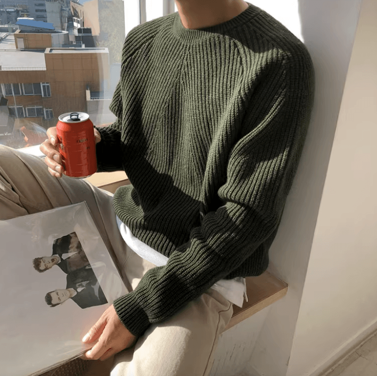Forest green 100% cotton ribbed sweater for men, showcasing a relaxed silhouette and comfortable raglan shoulders.