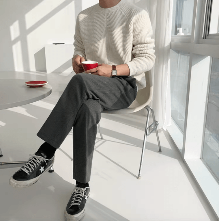 Clean white minimalist ribbed crew neck featuring ergonomic raglan sleeves and a premium matte finish.