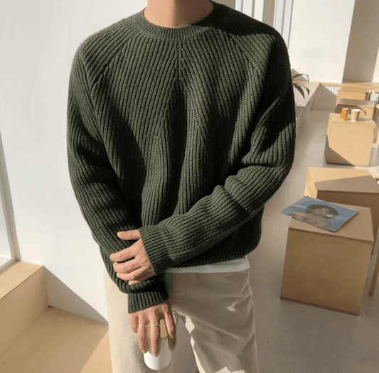 Forest green 100% cotton ribbed sweater for men, showcasing a relaxed silhouette and comfortable raglan shoulders.