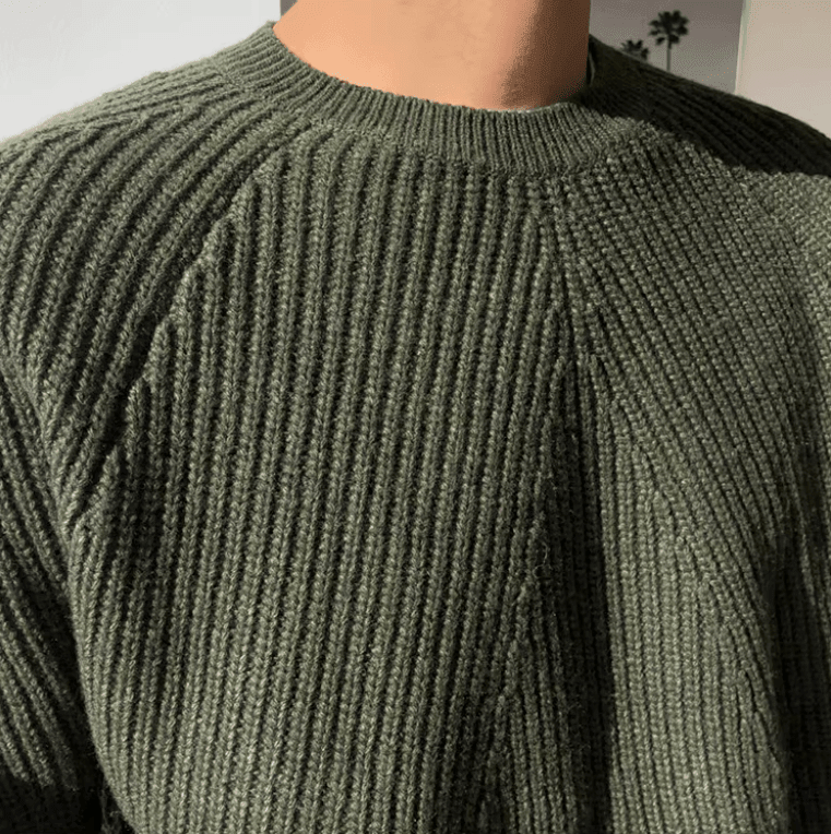 Forest green 100% cotton ribbed sweater for men, showcasing a relaxed silhouette and comfortable raglan shoulders.