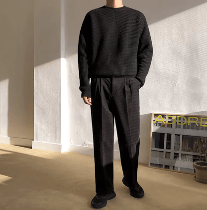 Classic black raglan sleeve crew neck for men with a technical vertical ribbed texture and loose fit.
