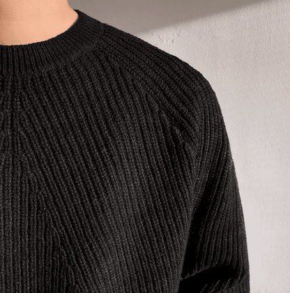 Classic black raglan sleeve crew neck for men with a technical vertical ribbed texture and loose fit.