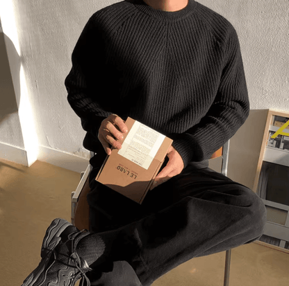 Classic black raglan sleeve crew neck for men with a technical vertical ribbed texture and loose fit.