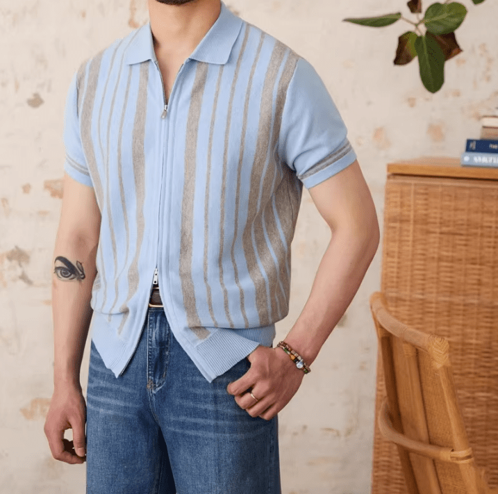 Men's light blue full-zip knitted cardigan featuring white striped trim on the collar and a short-sleeved polo design.