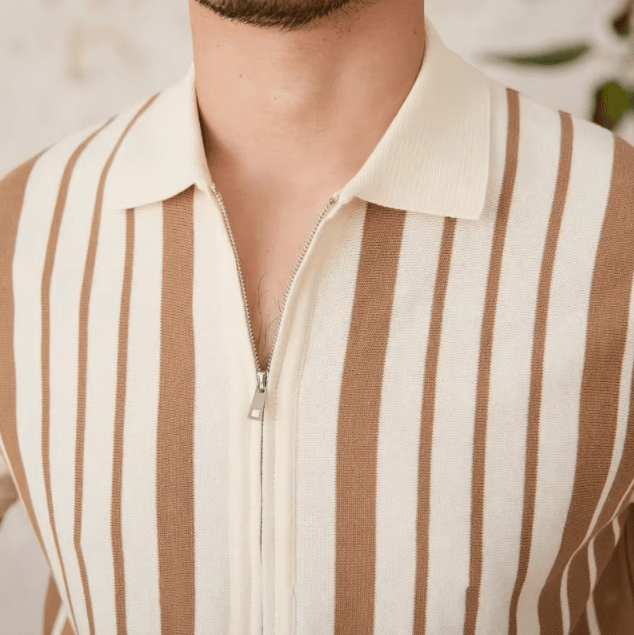 Close-up of the LORMIER metal zipper hardware and striped cuff on the breathable cotton knit cardigan.