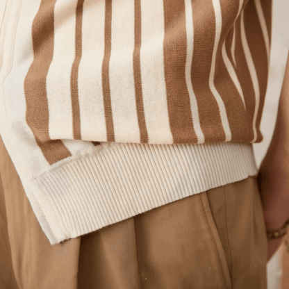 Close-up of the LORMIER metal zipper hardware and striped cuff on the breathable cotton knit cardigan.