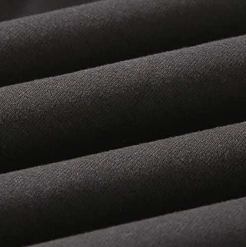 Close-up of the LORMIER 100% cotton textured weave, highlighting the 3D hybrid knit pattern and matte finish.