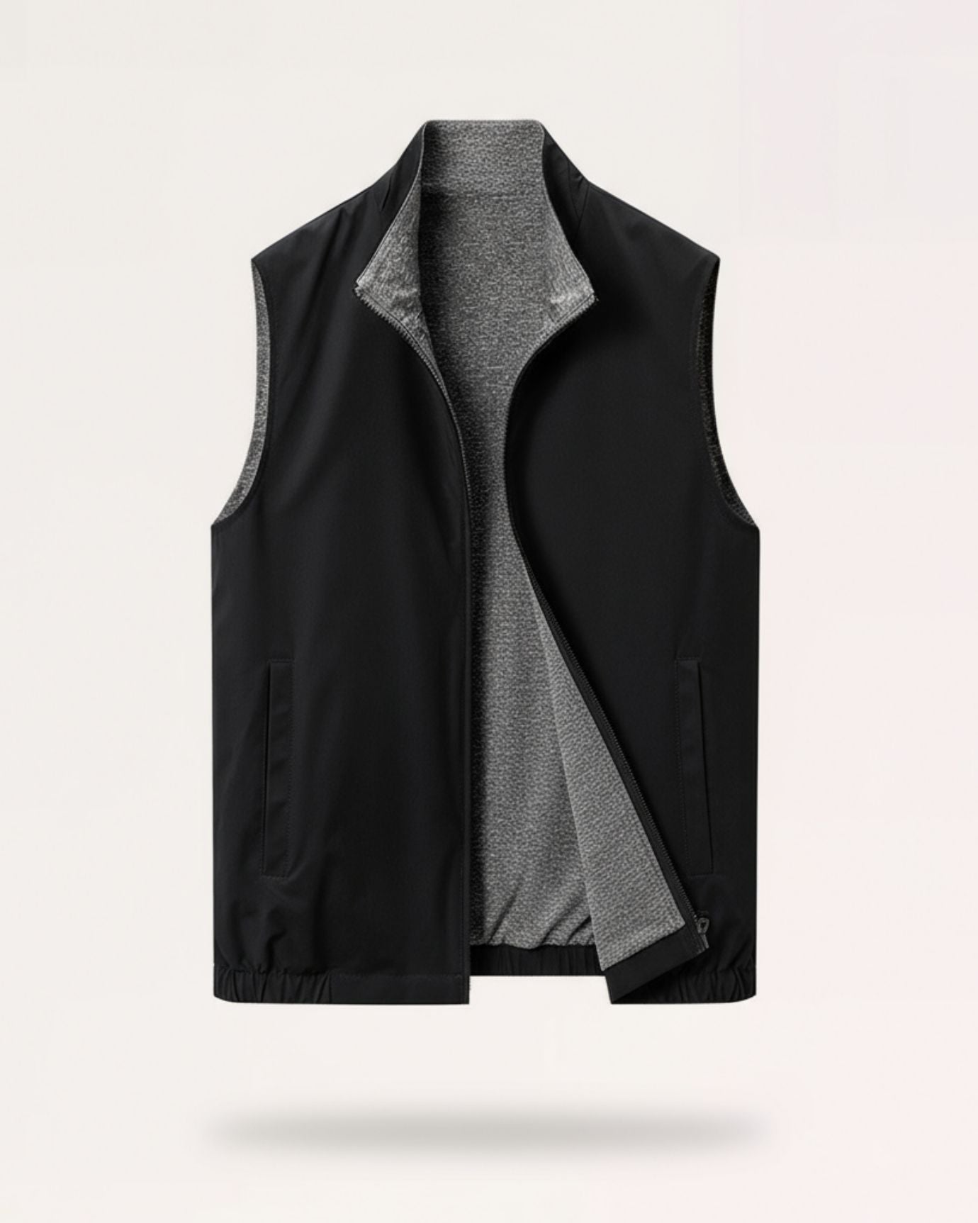 Classic black dual-texture reversible vest featuring a high-polish two-way zipper and low-profile welt pockets.
