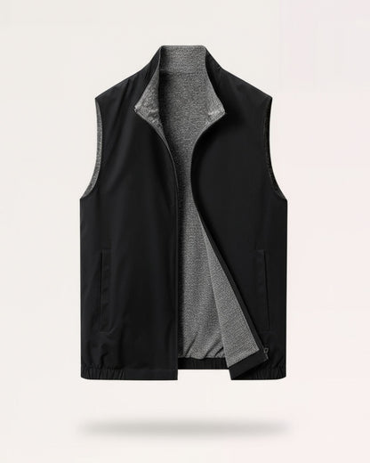 Classic black dual-texture reversible vest featuring a high-polish two-way zipper and low-profile welt pockets.