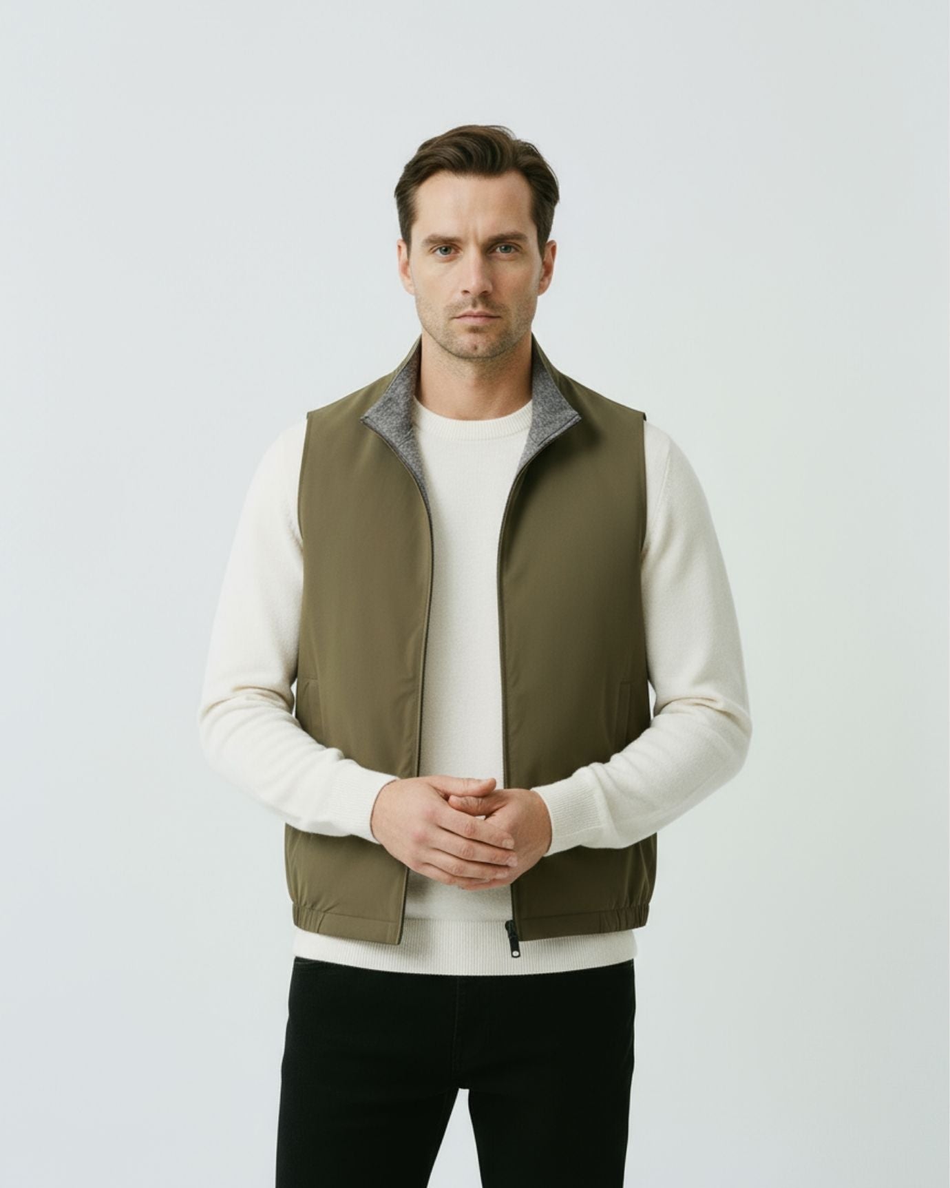 Modern olive green reversible zip vest for men, showcasing a streamlined silhouette and structured mock-neck collar.