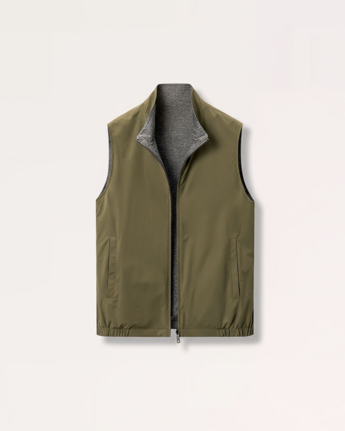 Modern olive green reversible zip vest for men, showcasing a streamlined silhouette and structured mock-neck collar.