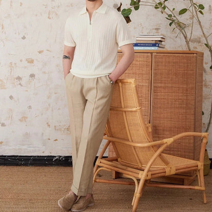 Men's crisp white ribbed half-zip polo crafted from a breathable linen blend with a modern metallic zipper detail.