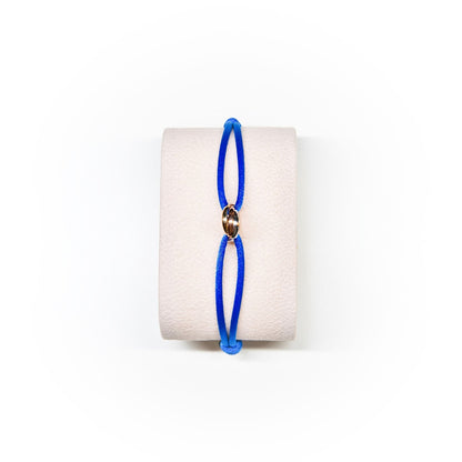 Blue bracelet on a white background