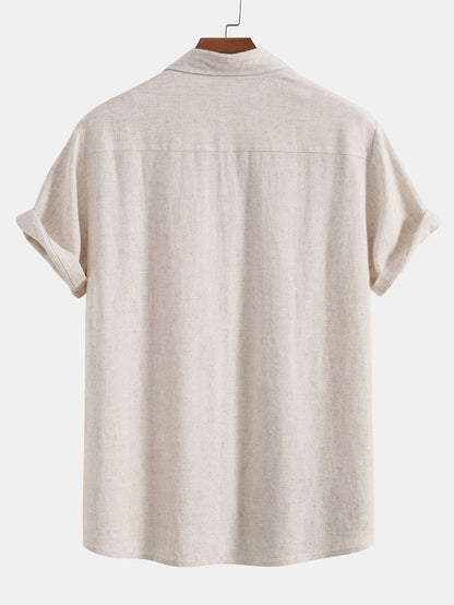 Beige short-sleeve shirt on a hanger against a white background